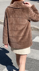 The coat shot on a street before the edit