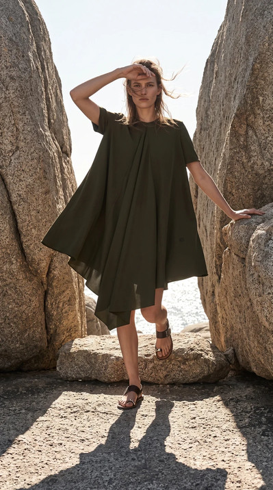 AI-generated on-model fashion photo: Draped tunic, Aegean coast